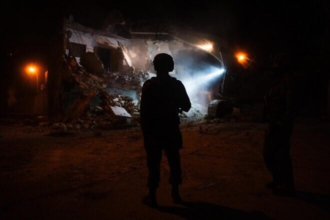 Israeli forces demolishing the home of a terrorist in Bal’a, Samaria, who took part in the deadly Nov. 2, 2023, attack at the Beit Lid Junction, Dec. 31, 2024. Credit: IDF.