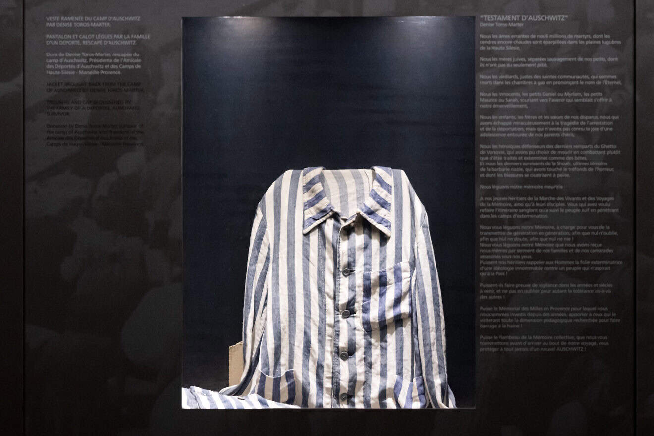 A uniform from the Auschwitz concentration camp displayed at the Camp des Milles, an internment and deportation center during World War II, during a visit by members of South Winners, the largest supporters' group of Olympique de Marseille football club, to raise awareness about antisemitism, Aix-en-Provence in southeastern France, on Dec. 23, 2024. Photo by Miguel Medina/AFP via Getty Images.