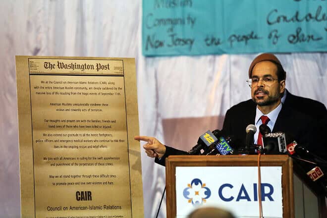 Nihad Awad, executive director of the Council on American-Islamic Relations, joins other community religious and political leaders at a news conference in Jersey City, N.J., on Dec. 3, 2015. Photo by Spencer Platt/Getty Images.