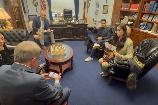 Noa Argamani holding a poster of her boyfriend Avinatan Or, who remains in Hamas captivity, during a meeting with U.S. Congress members in Washington, D.C., on Jan. 8, 2025. Source: YouTube/Israel International News.