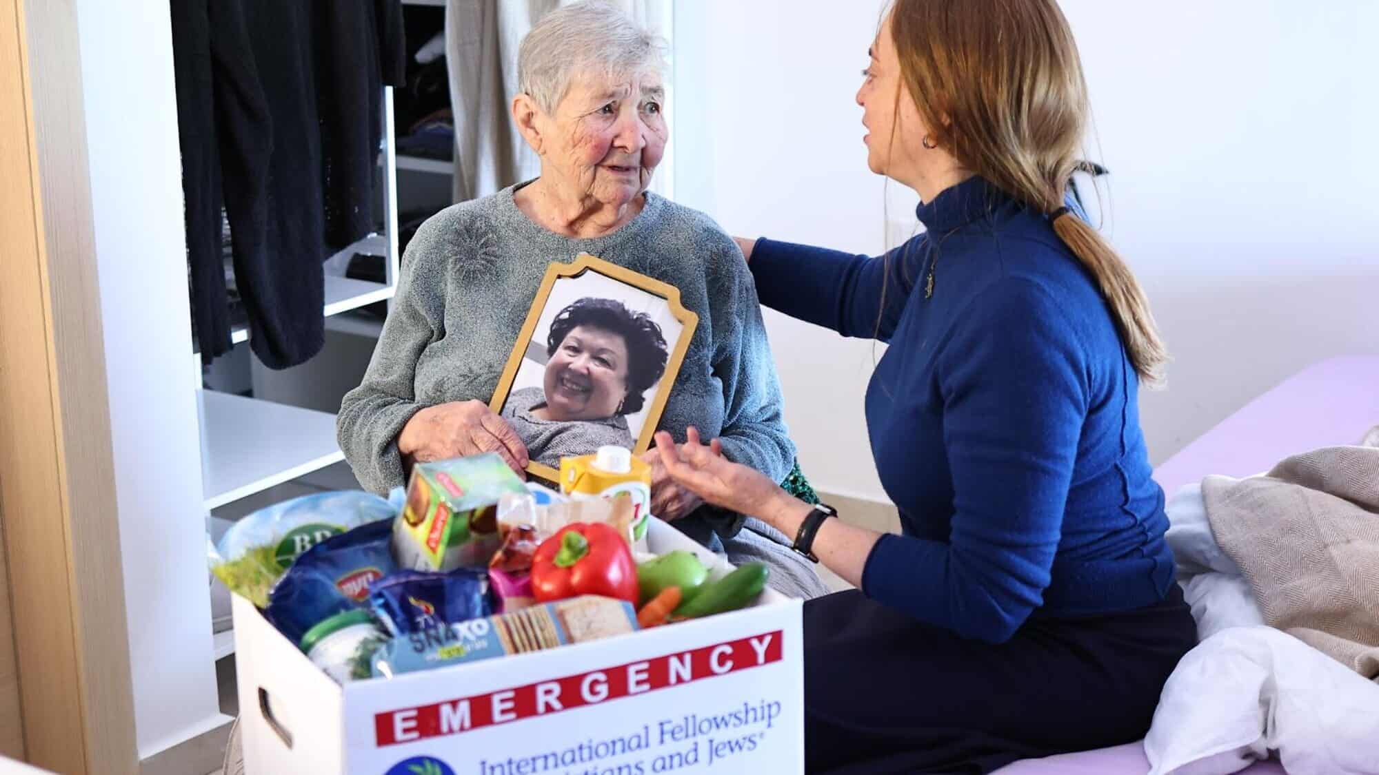 Holocaust survivor Galina Bailin (left) with a member of the International Fellowship of Jews and Christians. Photo: Mishel Amzalleg, IFCJ.