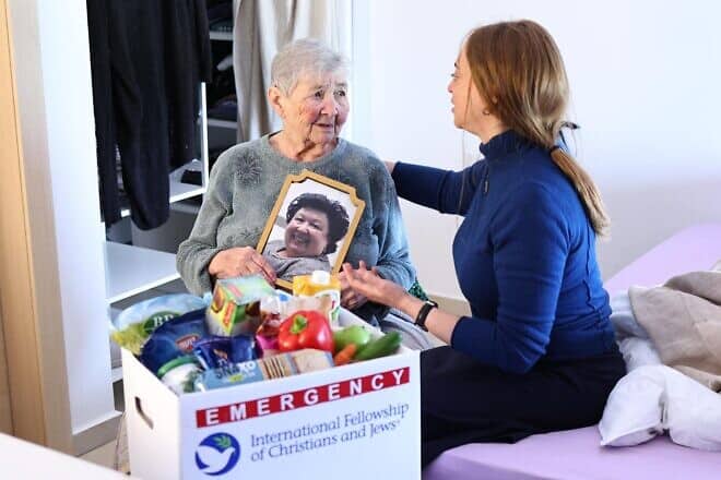 Holocaust survivor Galina Bailin (left) with a member of the International Fellowship of Jews and Christians. Photo: Mishel Amzalleg, IFCJ.