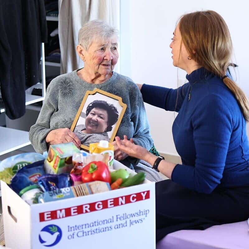 Holocaust survivor Galina Bailin (left) with a member of the International Fellowship of Jews and Christians. Photo: Mishel Amzalleg, IFCJ.