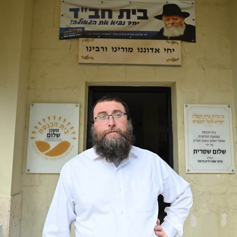 Rabbi Bentsion Gagula stands outside his synagogue in Haifa's German Colony neighborhood on Dec. 31, 2024. Photo by Canaan Lidor.