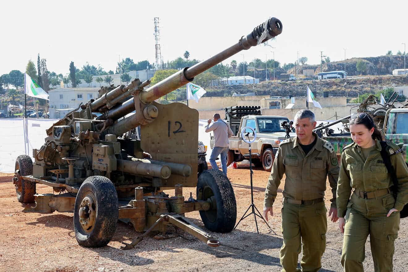 Israeli soldiers walks past weapons seized from Hezbollah in southern Lebanon, displayed for the media at an IDF base in the Galilee, on Dec, 23, 2024. Photo by Jack Guez/AFP via Getty Images