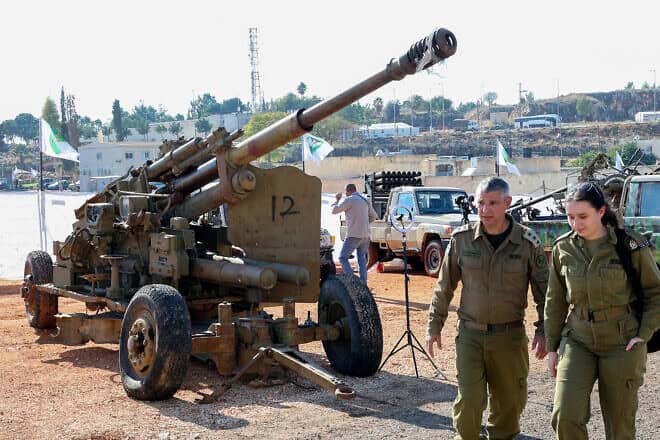 Israeli soldiers walks past weapons seized from Hezbollah in southern Lebanon, displayed for the media at an IDF base in the Galilee, on Dec, 23, 2024. Photo by Jack Guez/AFP via Getty Images