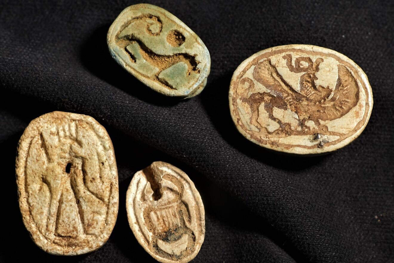 Egyptian-style scarabs with additional cultural influences found at a tomb complex in Israel's Negev Desert are evidence of encounters between different peoples, researchers say. Credit: Emil Aladjem/Israel Antiquities Authority.