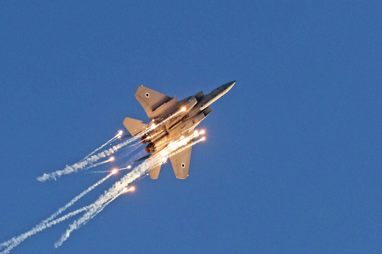 An F-15 Baz during an airshow with flares performs at the Hatzerim Air Force Base, June 24, 2021. Credit: Ofer Zidon/Flash90.