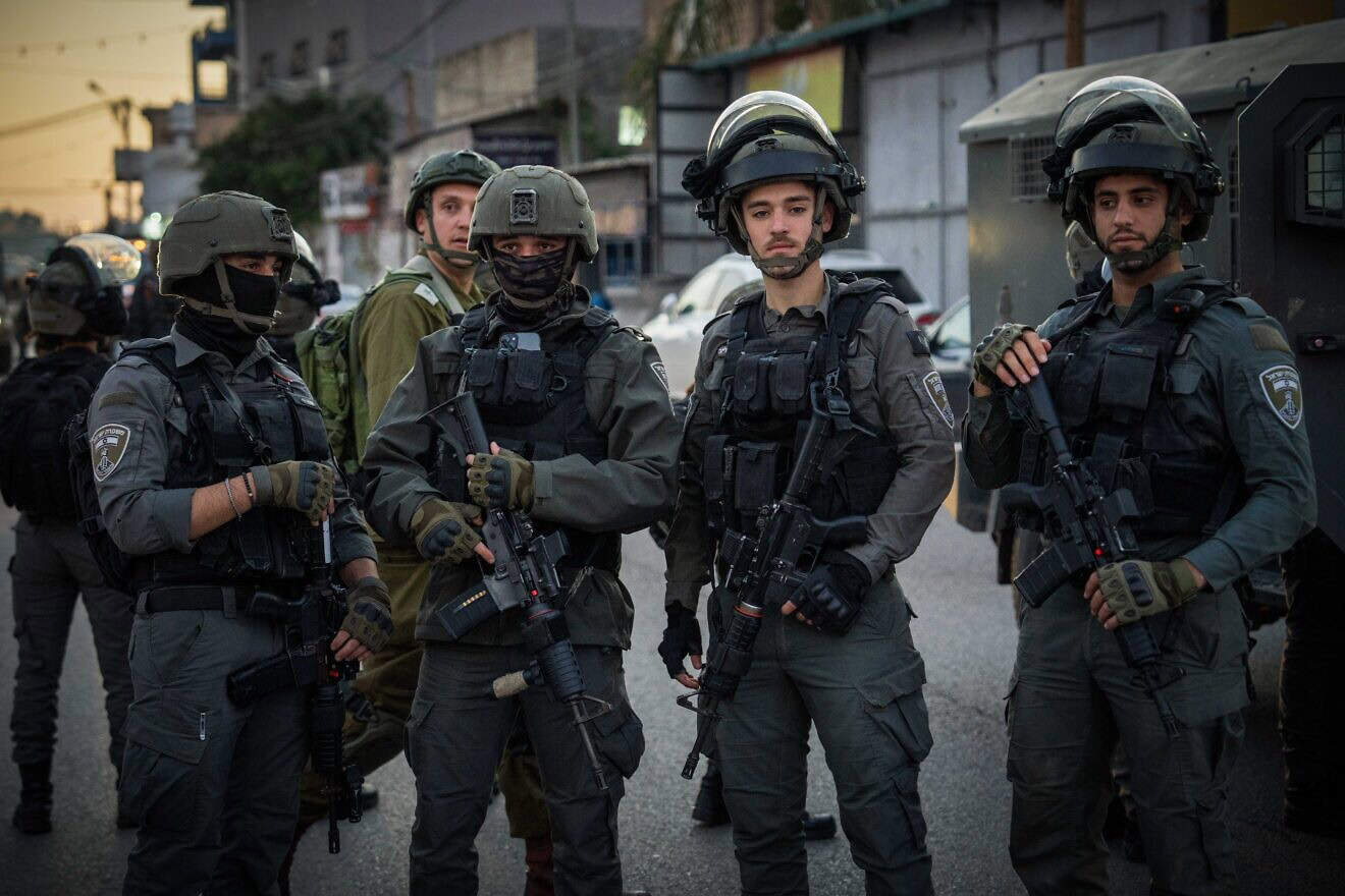 Israeli security forces guard the scene where three Israelis were murdered in the village of al-Funduq in Samaria, Jan. 6, 2025. Photo by Erik Marmor/Flash90.