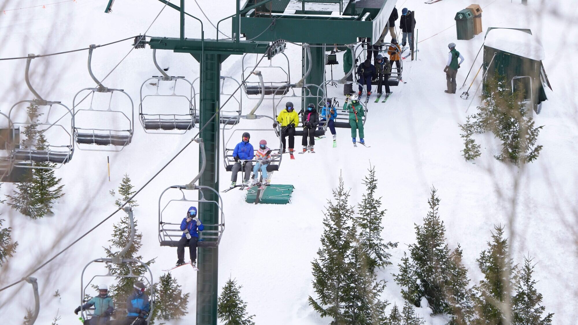 Skiers ride a lift at Deer Valley Ski Resort in Park City, Utah, on Dec. 23, 2022. Photo by George Frey/AFP via Getty Images.