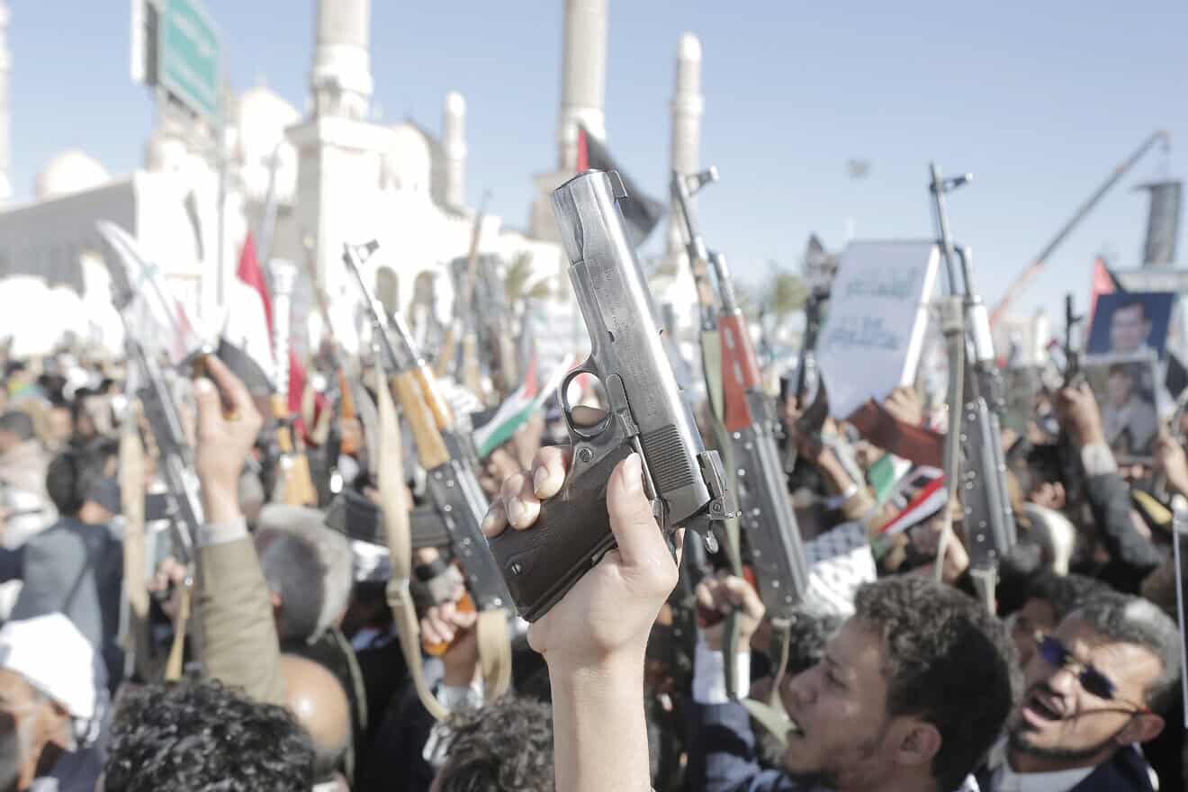 Yemen's Houthi followers brandish weapons and chant slogans as they take part in a protest staged in solidarity with the Palestinian people in Gaza, in Sana'a, Yemen, on Jan. 17, 2025. Photo by Mohammed Hamoud/Getty Images.