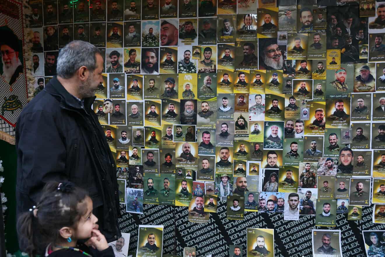 A wall plastered with portraits of slain Hezbollah members during a funeral ceremony in Ghobeiri in Beirut's southern suburbs on Jan. 27, 2025. Photo by Ibrahim Amro/AFP via Getty Images.