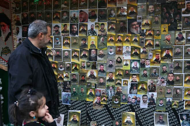 A wall plastered with portraits of slain Hezbollah members during a funeral ceremony in Ghobeiri in Beirut's southern suburbs on Jan. 27, 2025. Photo by Ibrahim Amro/AFP via Getty Images.