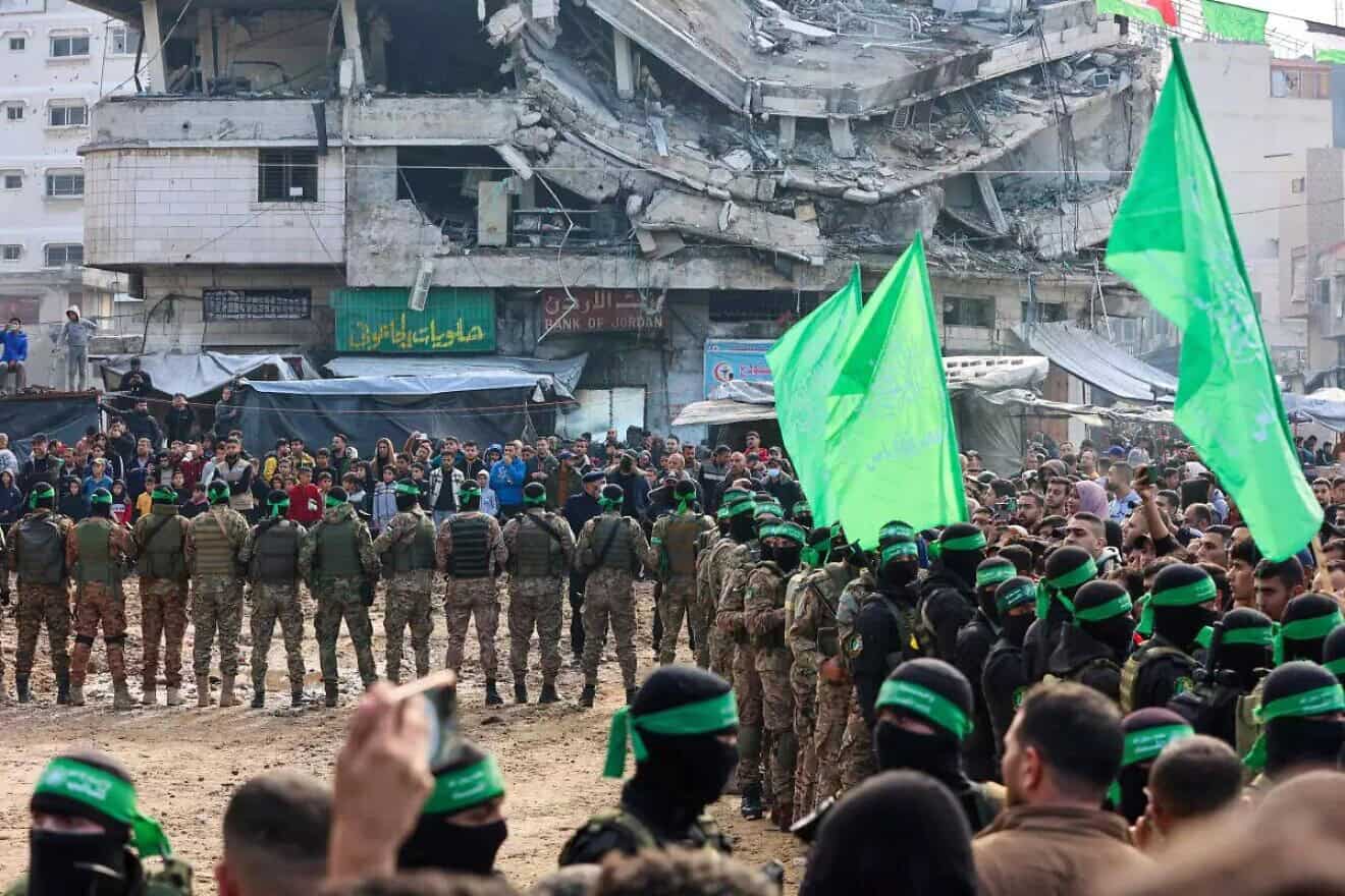 Hamas terrorists secure part of Palestine Square before handing over four Israeli hostages to a Red Cross team in Gaza City on Jan. 25, 2025. Credit: Israel Hayom.