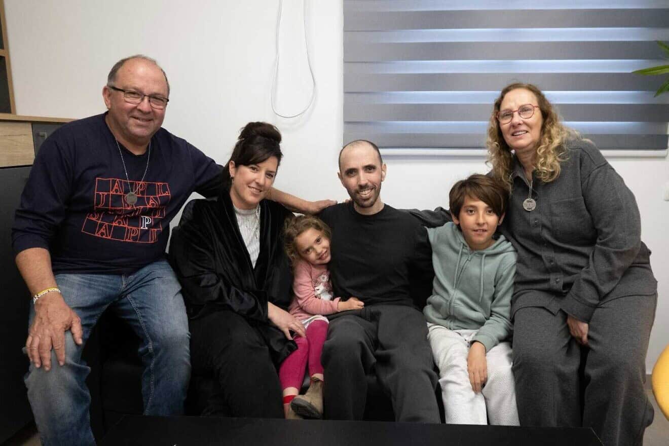 Tal Shoham (center) reunites with his family after 505 days in Hamas captivity, Feb. 22, 2025. Credit: IDF Spokesperson's Unit.
