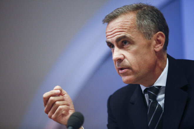 Mark Carney, governor of the Bank of England, gestures during the bank's quarterly inflation report news conference at the Bank of England in London, U.K., Nov. 13, 2013. Credit: Simon Dawson/Bloomberg/Bank of England via Creative Commons.