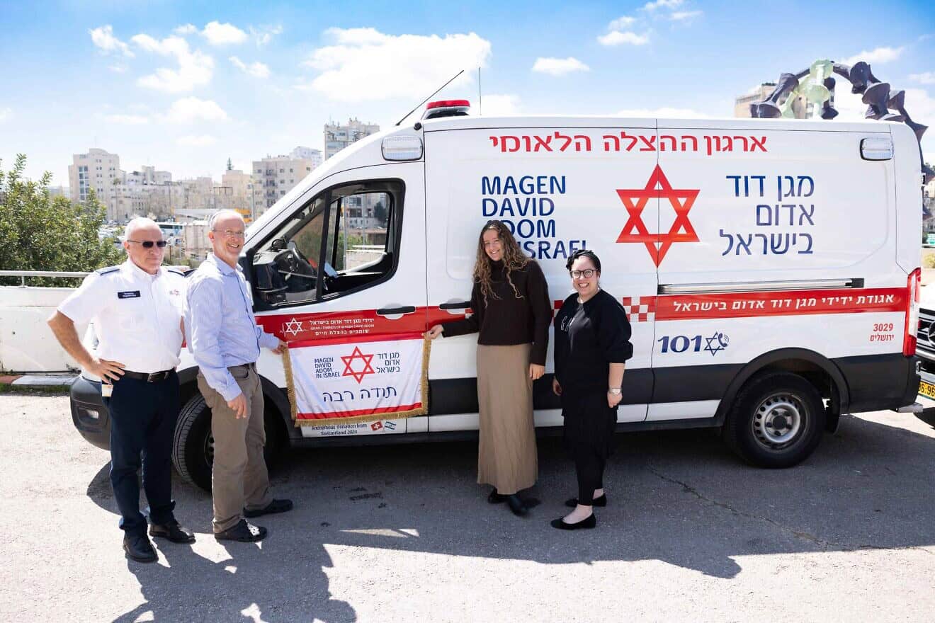 Rabbi Leo Dee and his daughter, Keren, with one of the ambulances donated in honor of Rina, Maia and Lucy Dee, March 2025. Photo by Eliran Avital.