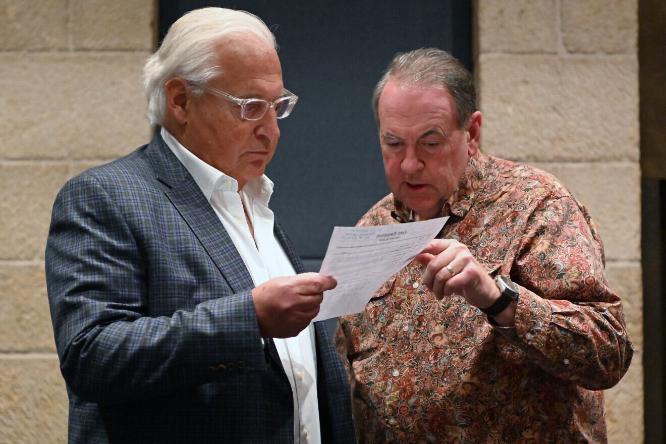 David Friedman, the U.S. ambassador to Israel, and Mike Huckabee, the former Arkansas governor, prepare to play music together at the David Citadel Hotel, Jerusalem, Feb. 12, 2019. Credit: Matty Stern/U.S. Embassy, Jerusalem.