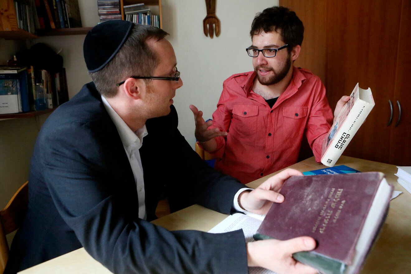 Yehuda Aronsson, who is Orthodox, and Ran Milon, who is secular, study Torah and subjects like literature and math as part of a project having secular and Orthodox people learn from each other, March 12, 2013. Credit: Miriam Alster/Flash90.