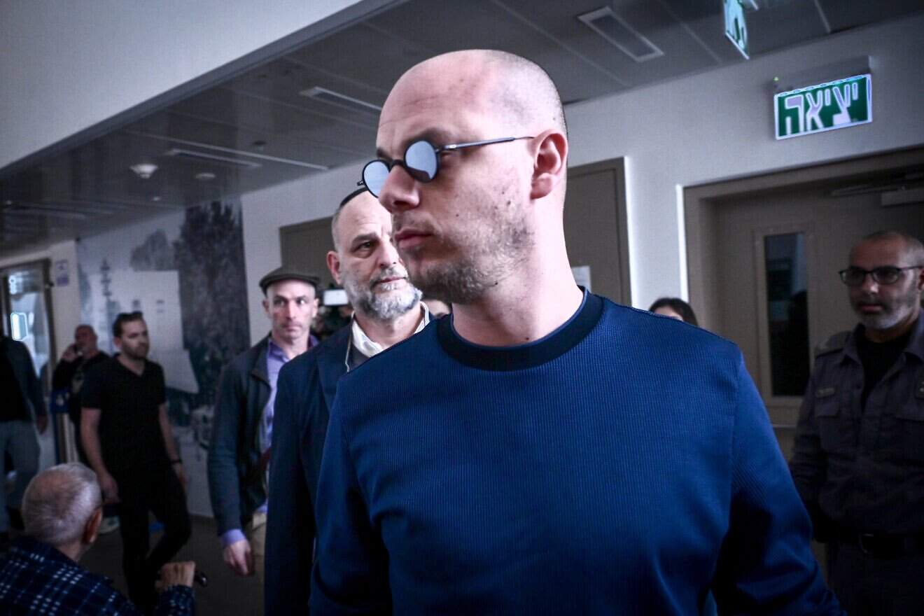 Eli Feldstein, accused of leaking classified documents, arrives to a court hearing at the District Court in Tel Aviv, Jan. 14, 2025. Photo by Avshalom Sassoni/Flash90.