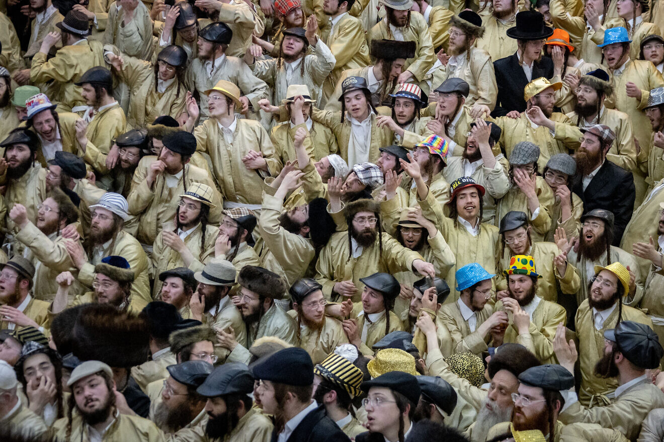 Members of the Toldos Aharon Hasidic dynasty celebrate the Jewish holiday of Purim in the ultra-orthodox Mea Shearim neighborhood in Jerusalem on March 16, 2025. Photo by Chaim Goldberg/Flash90.