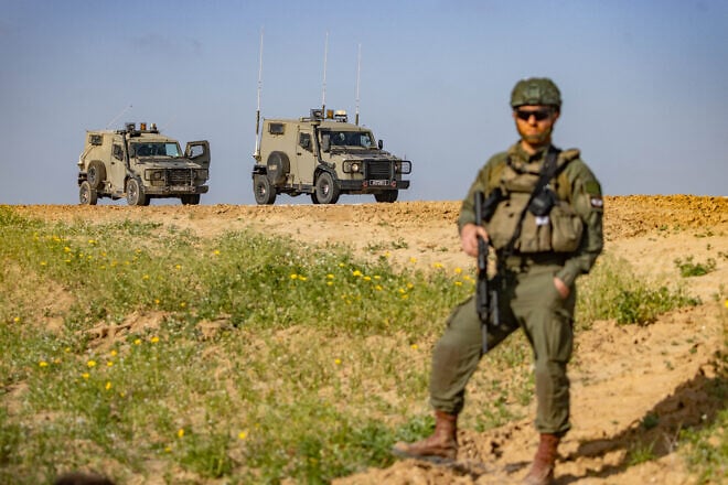 Israeli soldiers stand guard on the border with the Gaza Strip on March 18, 2025. Photo by Chaim Goldberg/Flash90.