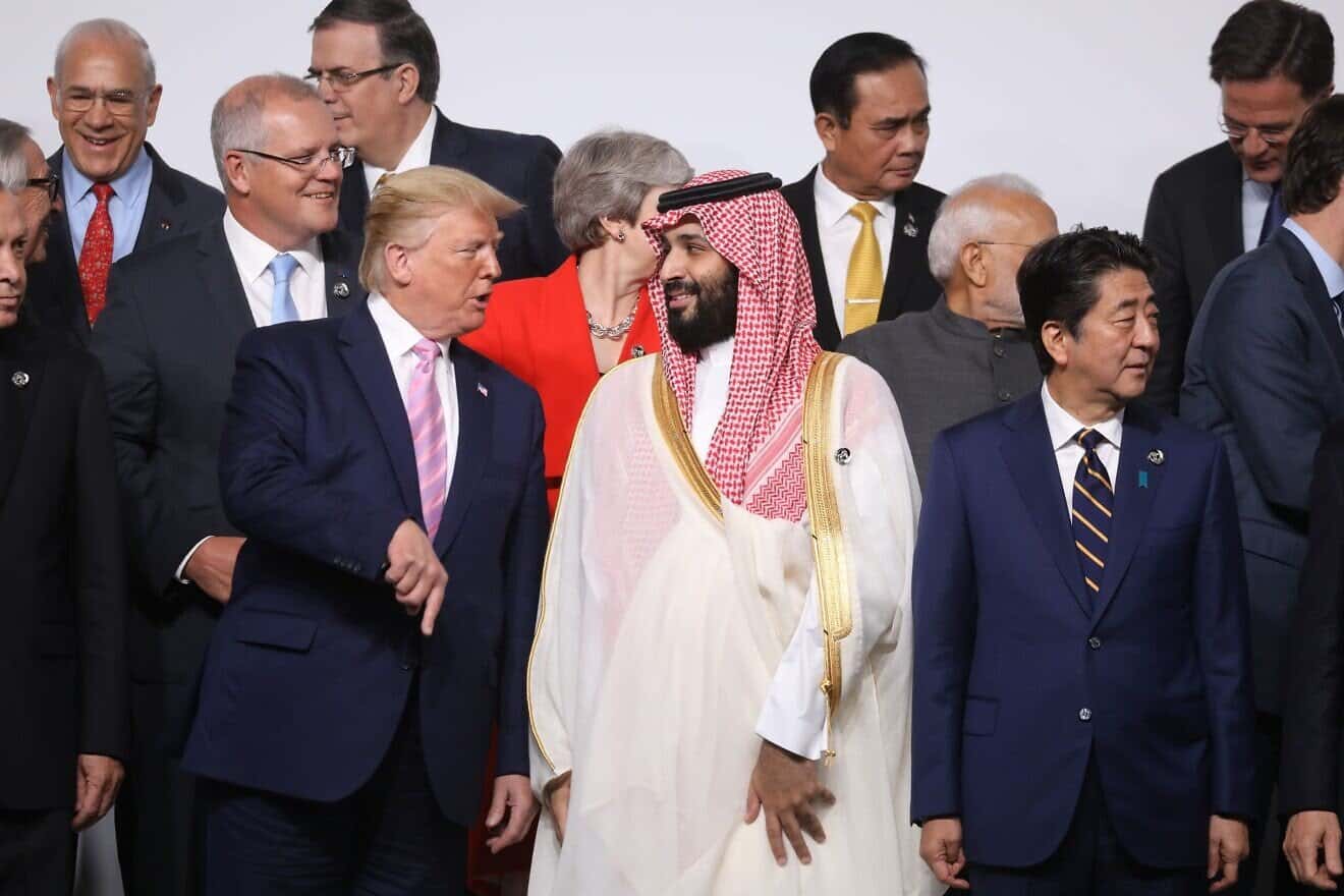 U.S. President Donald Trump and Saudi Arabia's Crown Prince Mohammed Bin Salman speak during the family photo at the G20 Osaka Summit in Osaka on June 28, 2019. Photo by Ludovic Marin/AFP via Getty Images.
