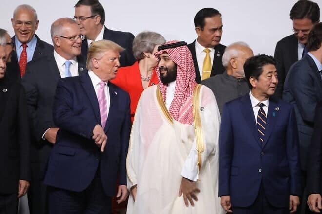 U.S. President Donald Trump and Saudi Arabia's Crown Prince Mohammed Bin Salman speak during the family photo at the G20 Osaka Summit in Osaka on June 28, 2019. Photo by Ludovic Marin/AFP via Getty Images.