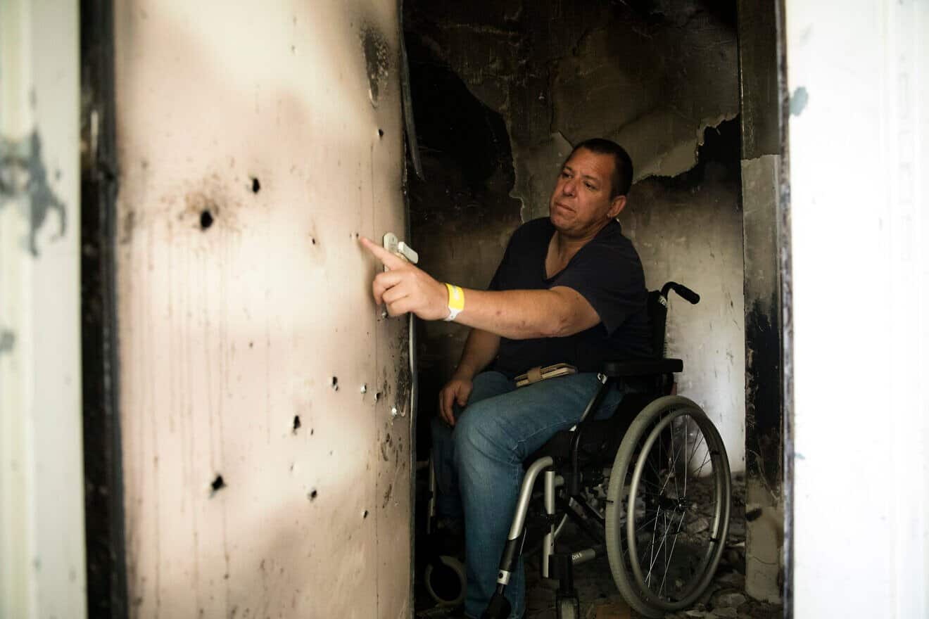 Avida Bachar inspects bullet holes in the bomb shelter of his Kibbutz Be'eri home, Jan. 8, 2024. Photo by Amir Levy/Getty Images.