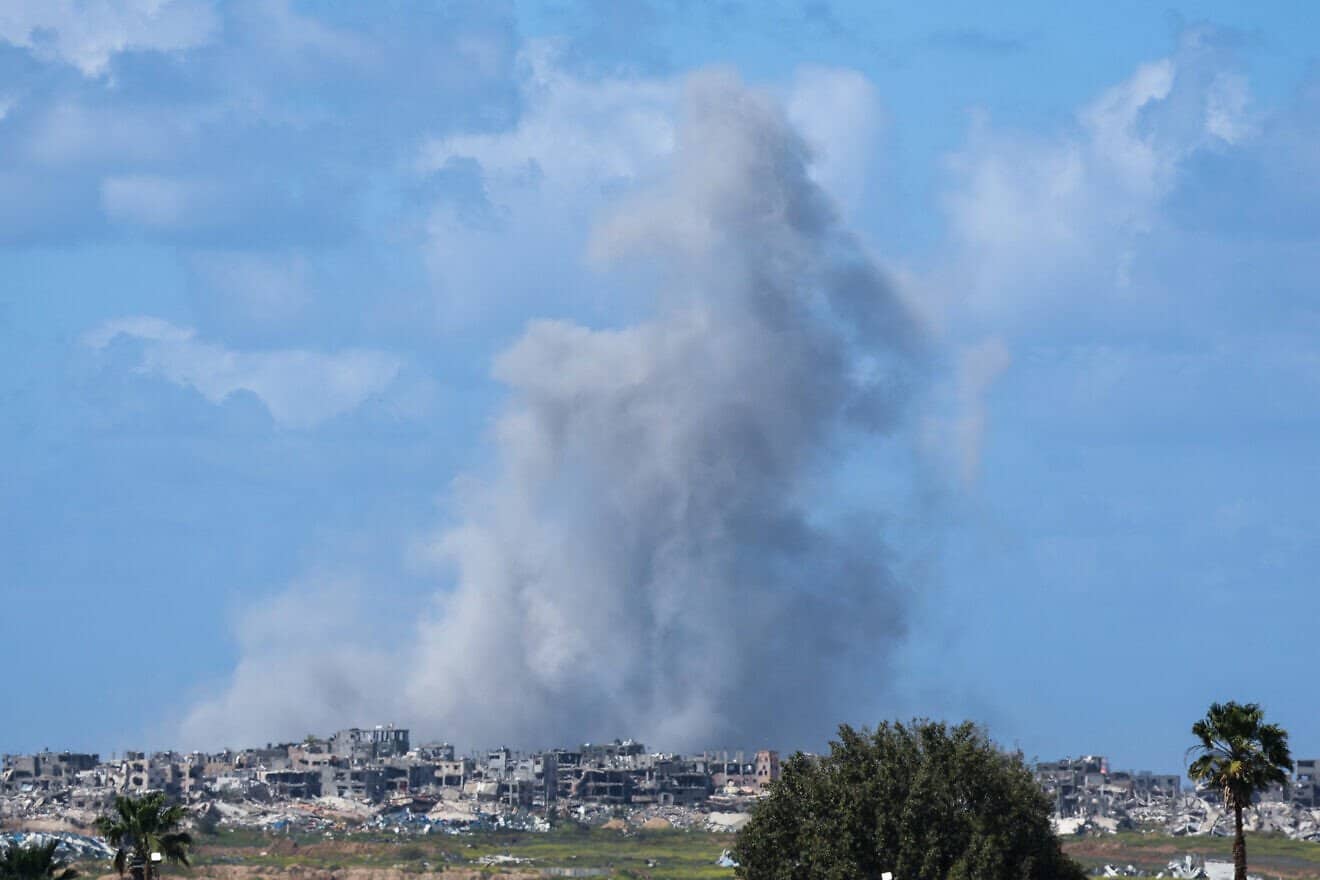 Smoke rises over destroyed buildings in northern Gaza, March 19, 2025. Photo by Jack Guez/AFP via Getty Images.