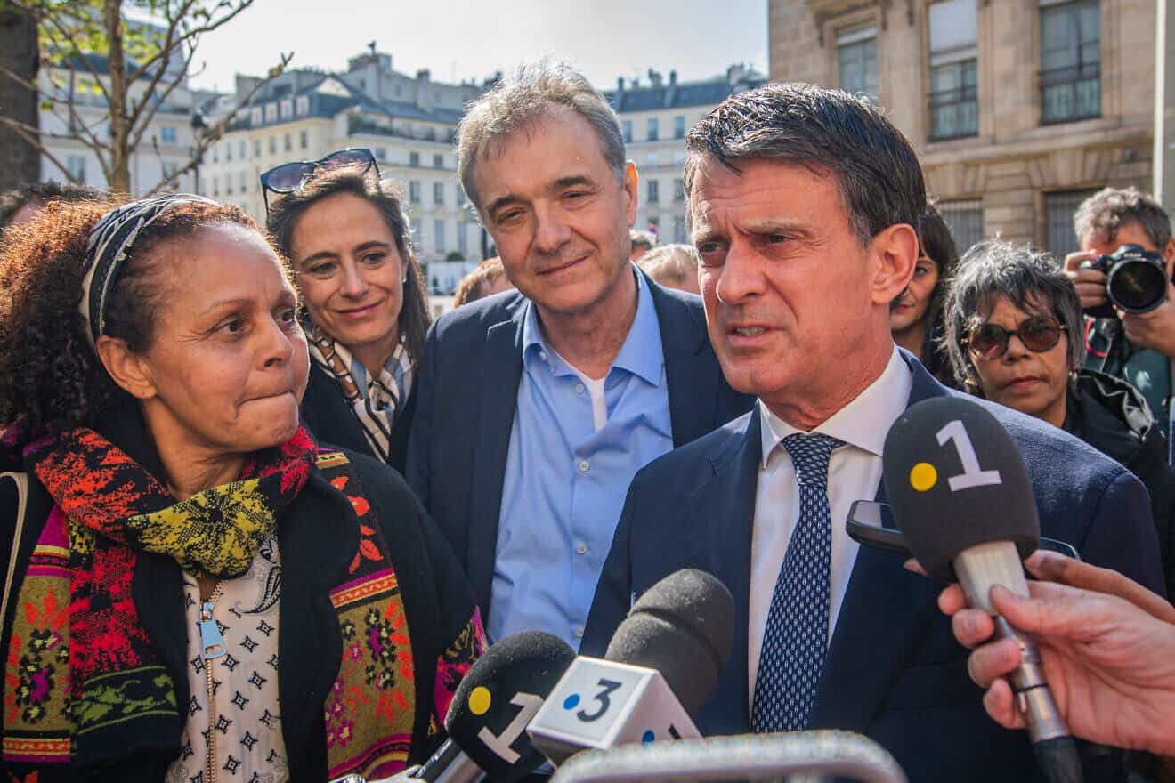 France's Minister of State for Overseas Territories Manuel Valls and Guido Fluri attend the presentation of MP Karine Lebon's bill on Wednesday, March 26, 2025, at the National Assembly in Paris. Photo by Simone Padovani/Getty Images.
