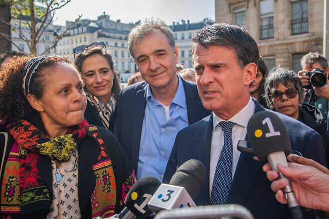 France's Minister of State for Overseas Territories Manuel Valls and Guido Fluri attend the presentation of MP Karine Lebon's bill on Wednesday, March 26, 2025, at the National Assembly in Paris. Photo by Simone Padovani/Getty Images.