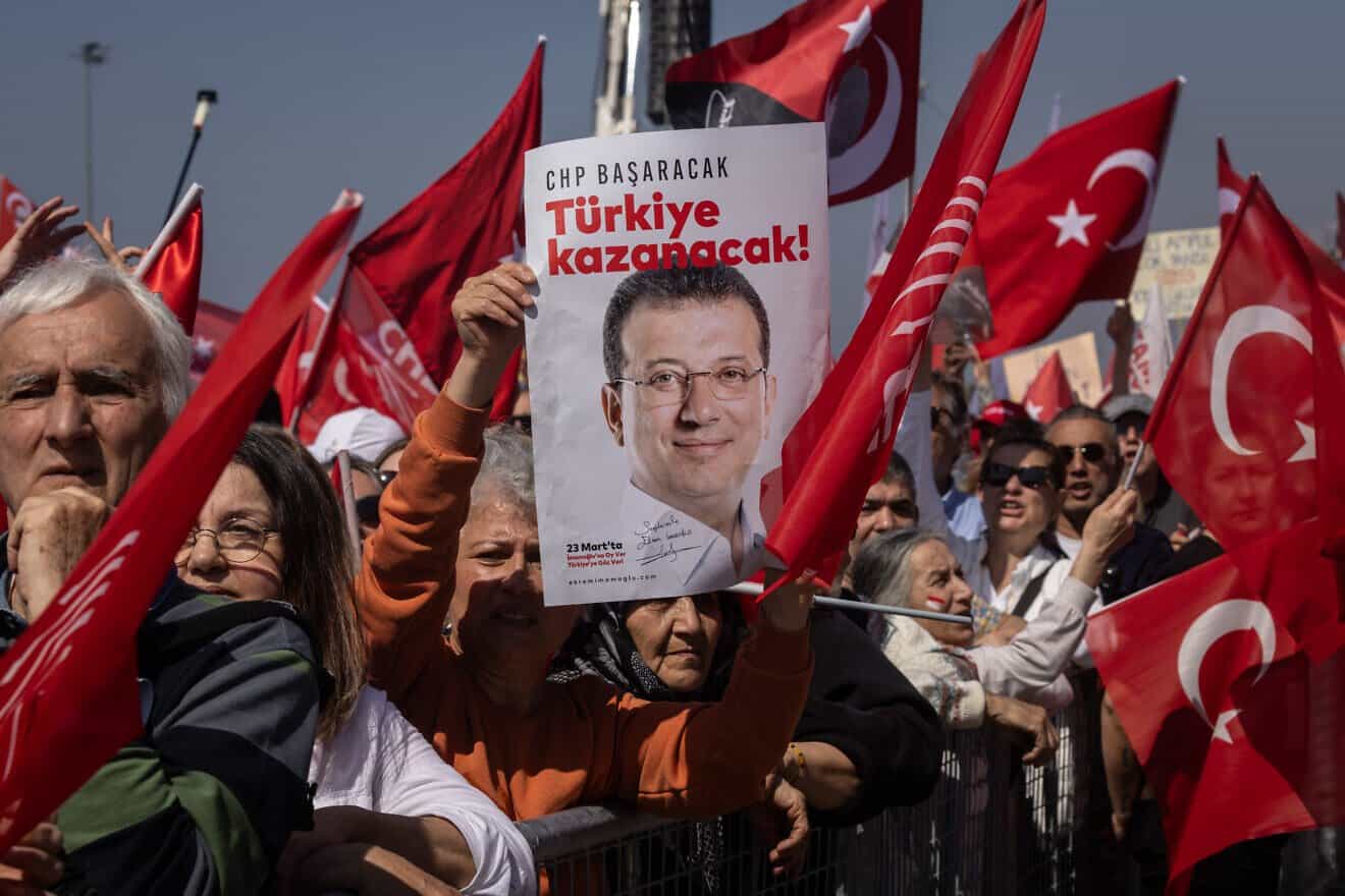 A supporter holds a poster of Ekrem Imamoglu during a mass protest rally in support of the arrested Istanbul mayor, March 29, 2025 in Istanbul, Turkey. Photo by Burak Kara/Getty Images.