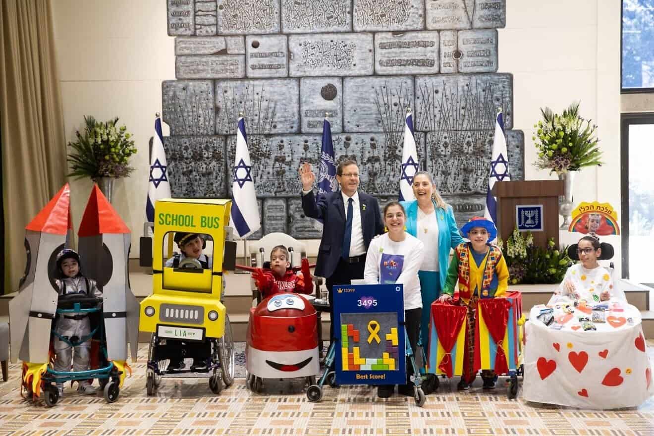 Israeli President Isaac Herzog and first lady Michal Herzog host a pre-Purim event for children with special needs at the President's Residence in Jerusalem on March 10, 2025. Photo courtesy of Beit HaNasi.