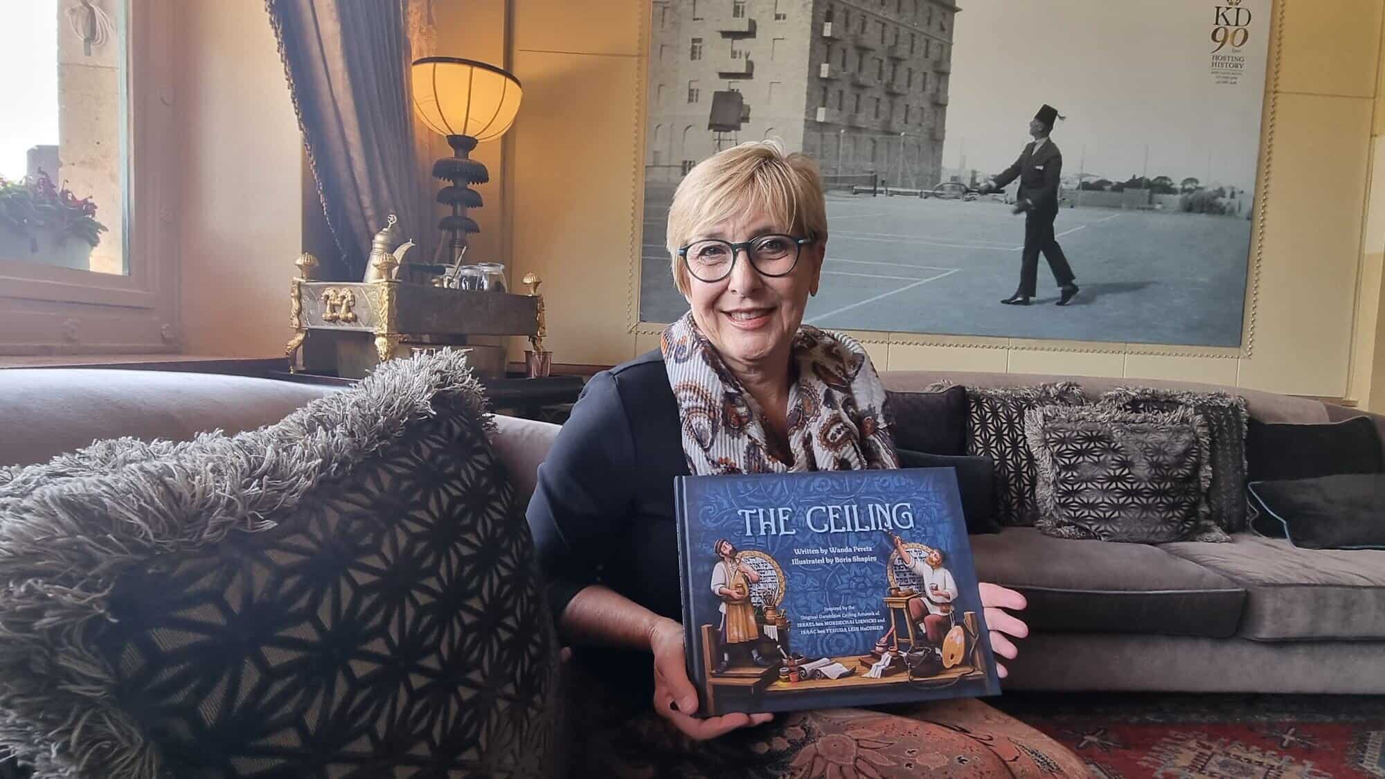 Wanda Peretz with a copy of her book at the King David Hotel in Jerusalem. Photo by Sharon Altshul.
