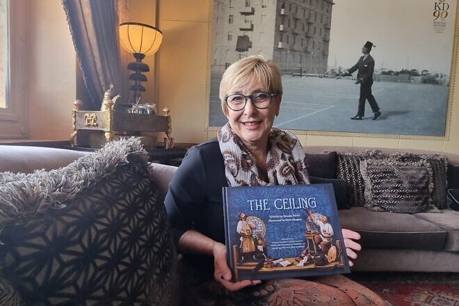 Wanda Peretz with a copy of her book.