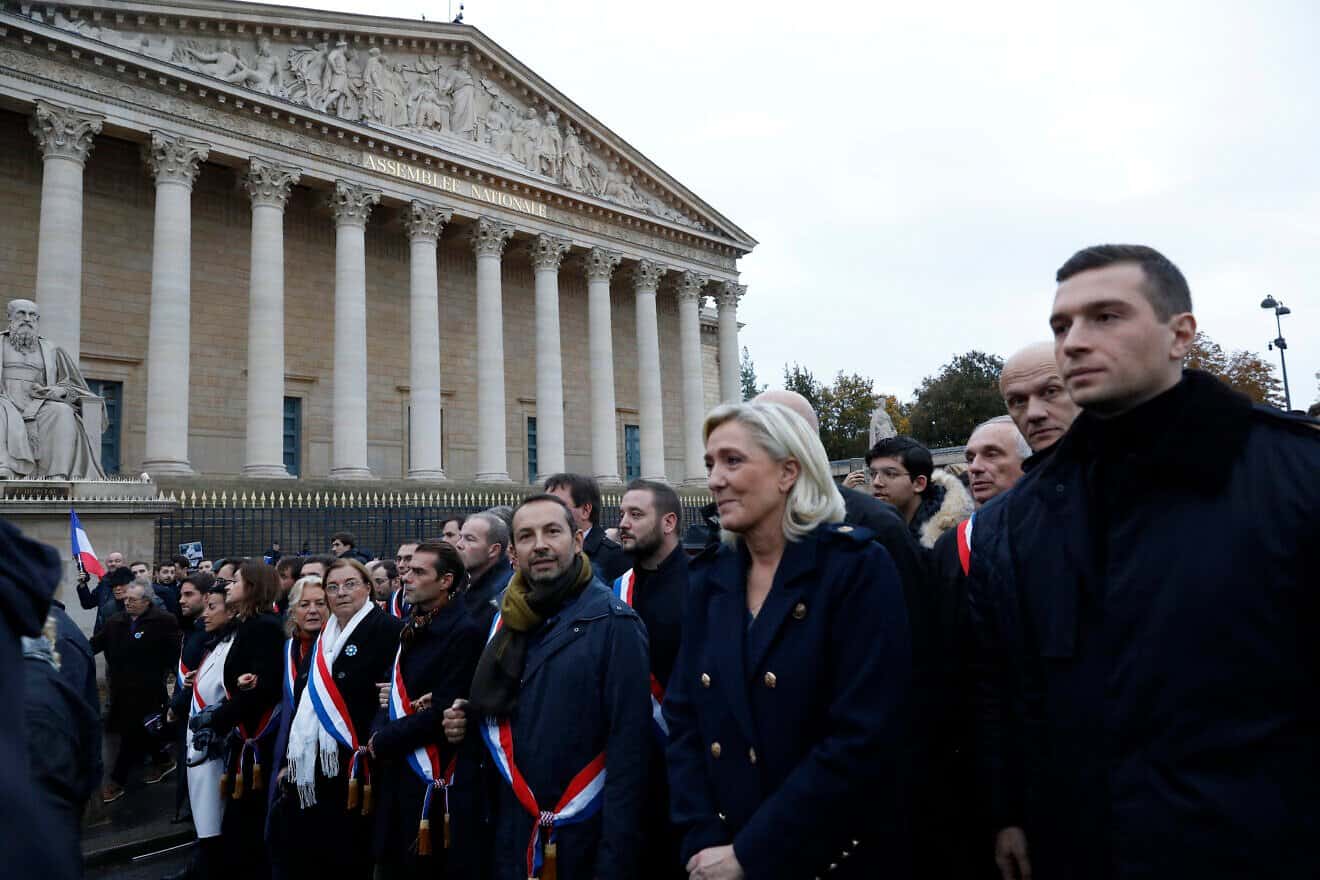 French far-right politician Marine Le Pen (second from right) and deputies including Sebastien Chenu to her right and Jordan Bardella, president of the National Rally (right) participate in a march against antisemitism from the Esplanade des Invalides to the Senate on Nov. 12, 2023 in Paris. Photo by Antoine Gyori-Corbis/Corbis via Getty Images.