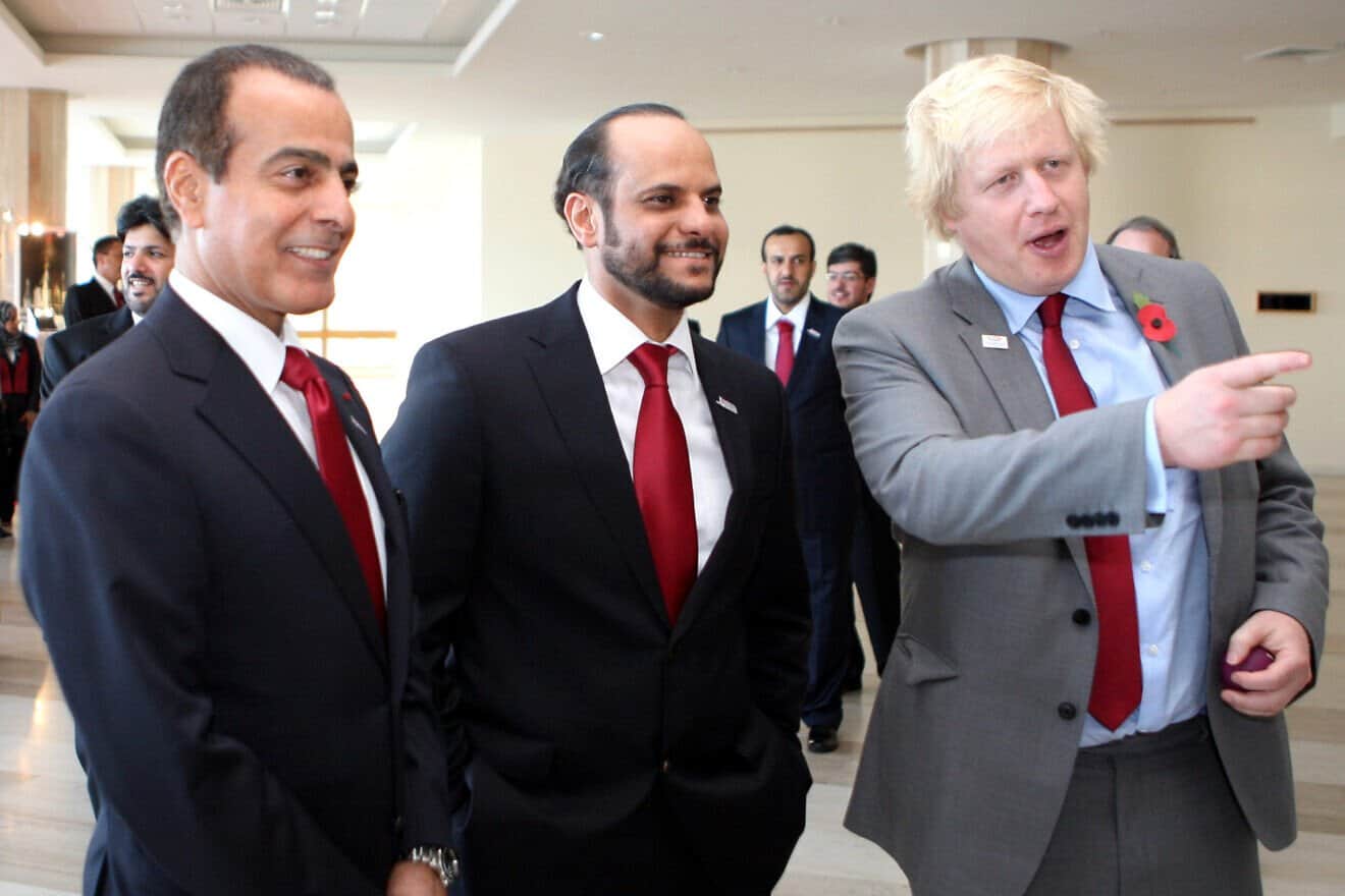 Qatari Deputy Prime Minister and Minister of State for Defense Affairs Saoud bin Abdulrahman Al Thani (center), then head of the Qatar Olympic Committee, and then-London Mayor Boris Johnson, Nov. 11, 2011. Credit: Mohan via Wikimedia Commons.