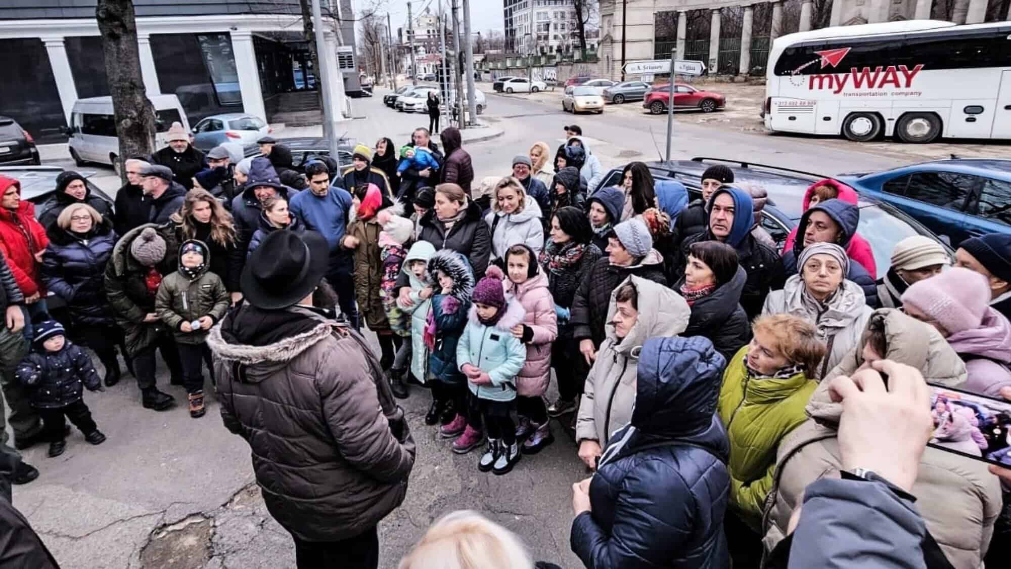 Ukrainian Jews in Moldova en route to Israel listen to Rabbi Yitzchak Halfon. Credit: Courtesy.
