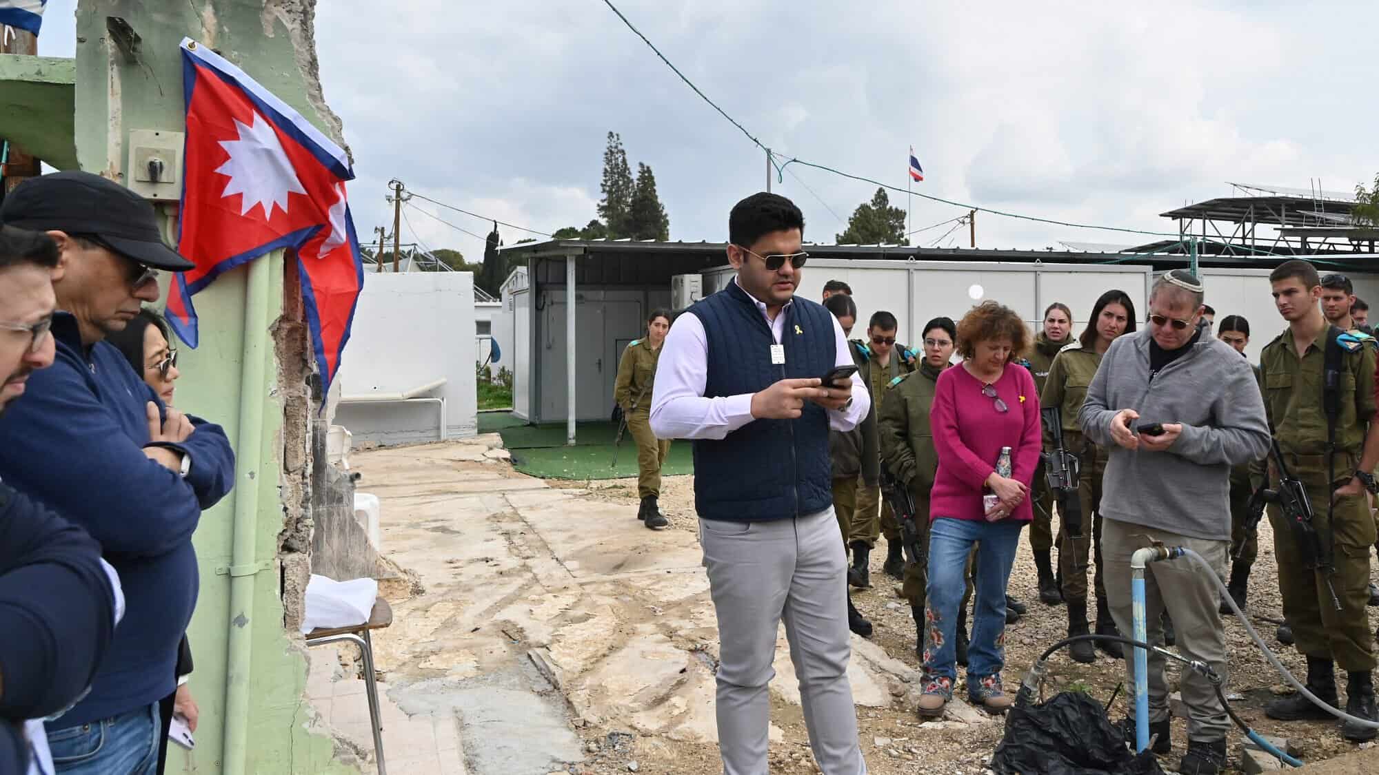 Pravesh Jiral commemorates his murdered countrymen in Kibbutz Alumim, Israel on Feb. 13, 2025. Photo by Canaan Lidor.
