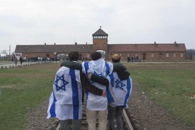 Hillel Kofsky (right) tours at the Auschwitz-Birkenau concentration camp grounds as part of a gap-year program in Israel, March 28, 2025. Credit: Courtesy.