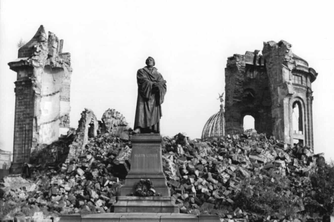 A statue of Protestant Reformation Martin Luther in the Ruins of Dresden, Germany, in the aftermath of World War II. Credit: Giso Löwe/German Federal Archives via Wikimedia Commons.