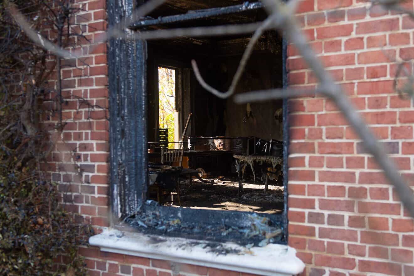 Extensive fire damage to the Pennsylvania Governor's Mansion in Harrisburg, the residence of Gov. Josh Shapiro, after an arson attack on April 12, seen during a press conference on April 13, 2025. Photo by Matthew Hatcher/Getty Images.