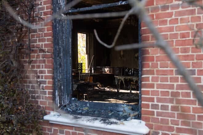 Extensive fire damage to the Pennsylvania Governor's Mansion in Harrisburg, the residence of Gov. Josh Shapiro, after an arson attack on April 12, seen during a press conference on April 13, 2025. Photo by Matthew Hatcher/Getty Images.