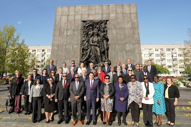 Dozens of U.N. ambassadors from around the world, including Israeli envoy Danny Danon (fifth from left, center row) in Warsaw, Poland, as part of a March of the Living delegation marking the 80th anniversary of the liberation of the Auschwitz concentration camp, April 23, 2025. Credit: Courtesy of the Israeli mission to the United Nations in New York.