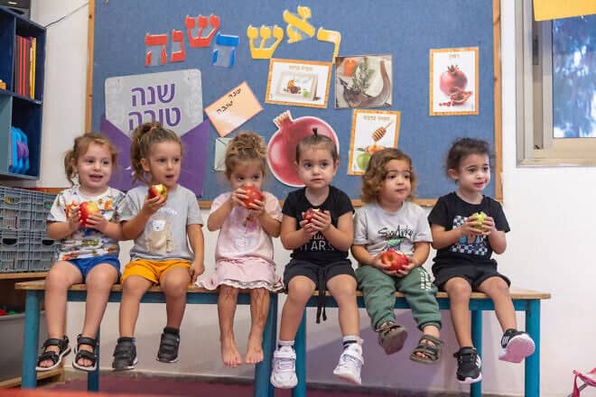 Children learn about the customs of Rosh Hashanah ahead of the Jewish New Year at a kindergarten in Moshav Yashresh in central Israel, Oct. 1, 2024. Photo by Yossi Aloni/Flash90.