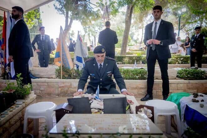 IDF Chief of Staff Lt. Gen. Eyal Zamir lays an Israeli flag on the grave of the last Israeli soldier who was buried, at Mount Herzl military cemetery in Jerusalem on April 28, 2025. Photo by Chaim Goldberg/Flash90.