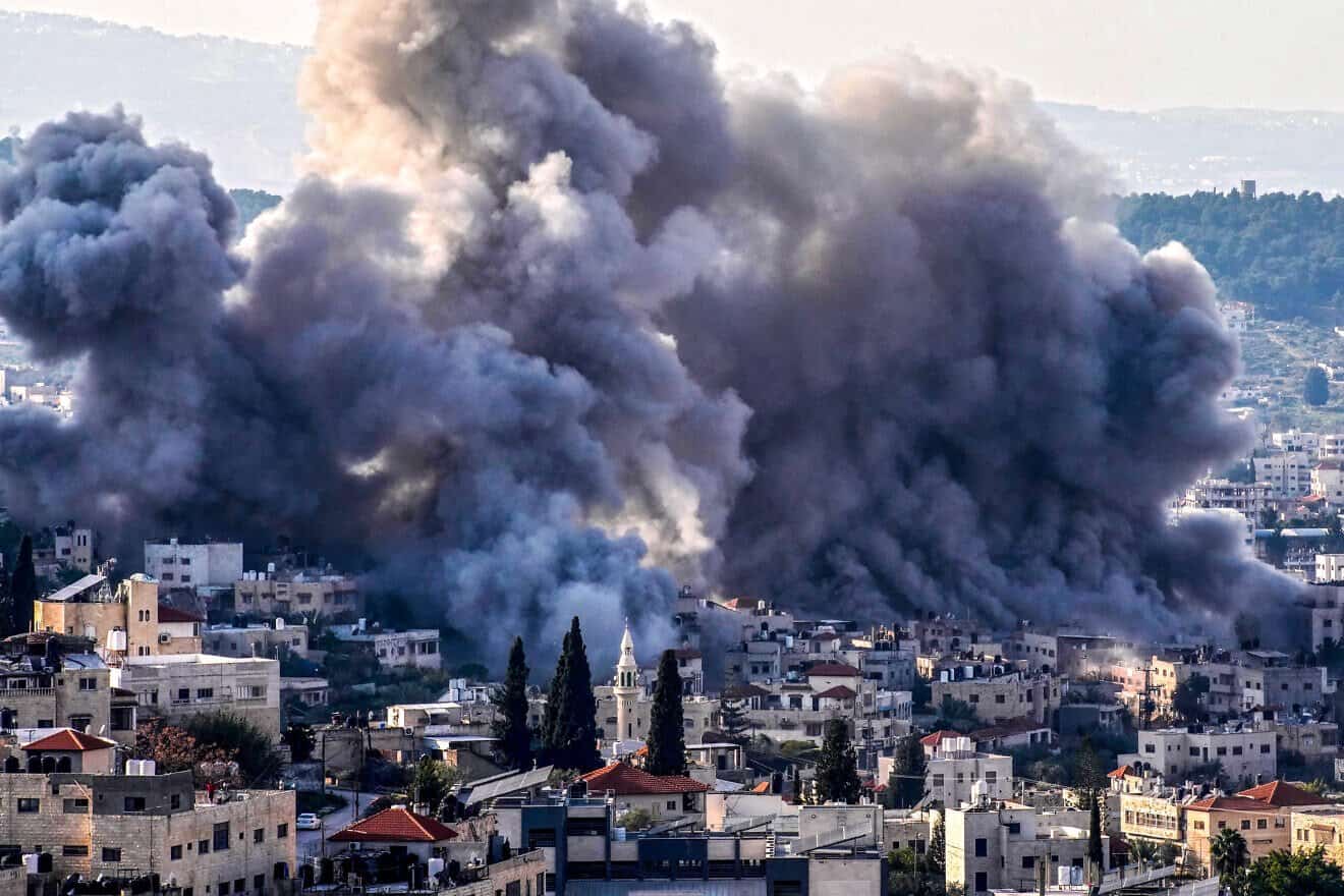 Smoke billows from the site of several explosions during an Israeli raid on the Jenin camp in northern Samaria, Feb. 2, 2025. Photo by Mohammad Mansour/AFP via Getty Images.