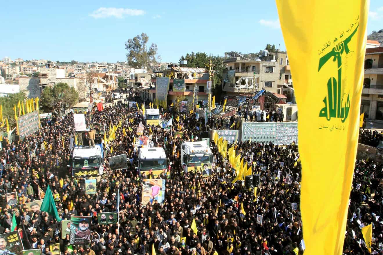 Mourners attend the funeral of 95 Hezbollah fighters and civilians killed in Israeli airstrikes during hostilities that lasted more than a year between Israel and Hezbollah, in the Southern Lebanese border town of Aitaroun, Feb. 28, 2025. Photo by Mahmoud Zayyat/AFP via Getty Images.