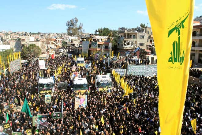 Mourners attend the funeral of 95 Hezbollah fighters and civilians killed in Israeli airstrikes during hostilities that lasted more than a year between Israel and Hezbollah, in the Southern Lebanese border town of Aitaroun, Feb. 28, 2025. Photo by Mahmoud Zayyat/AFP via Getty Images.